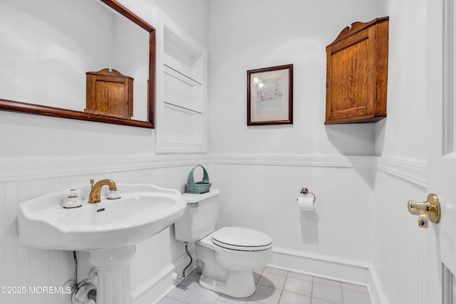 817 S Ocean Ave, Seaside Park, NJ 08752 - half bath featuring toilet, wainscoting, and tile patterned flooring
