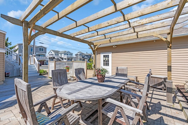 817 S Ocean Ave, Seaside Park, NJ 08752 - view of patio / terrace featuring a pergola, outdoor dining area, stairway, a wooden deck, and a residential view