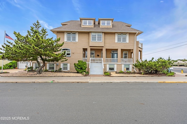 817 S Ocean Ave, Seaside Park, NJ 08752 - townhome / multi-family property with a porch and roof with shingles
