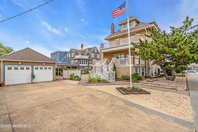 817 S Ocean Ave, Seaside Park, NJ 08752 - view of front of house featuring a balcony, a residential view, a porch, stairway, and a shingled roof