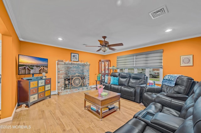 255 Cherokee Trl, Forked River, NJ 08731 - living room featuring a ceiling fan, crown molding, a brick fireplace, recessed lighting, and baseboards