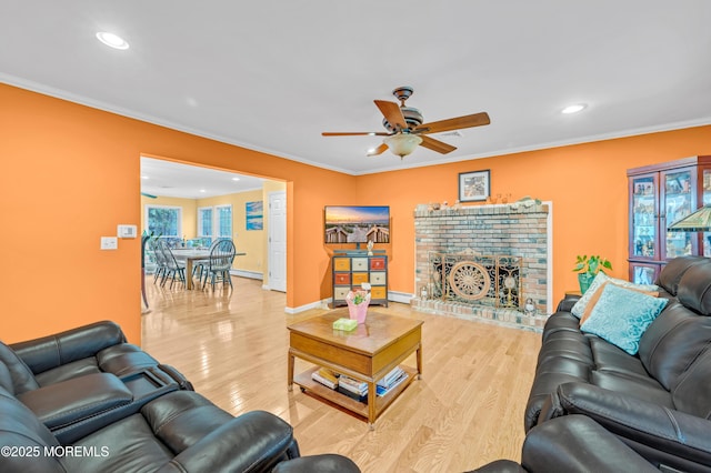 255 Cherokee Trl, Forked River, NJ 08731 - living area with a ceiling fan, recessed lighting, light wood-style flooring, a brick fireplace, and ornamental molding