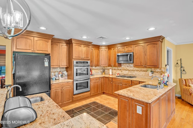 255 Cherokee Trl, Forked River, NJ 08731 - kitchen with stainless steel appliances, a sink, light stone countertops, recessed lighting, and decorative backsplash