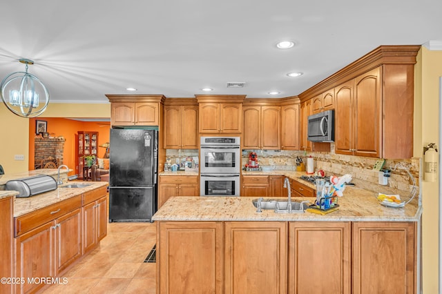 255 Cherokee Trl, Forked River, NJ 08731 - kitchen featuring appliances with stainless steel finishes, a sink, a peninsula, light stone counters, and recessed lighting