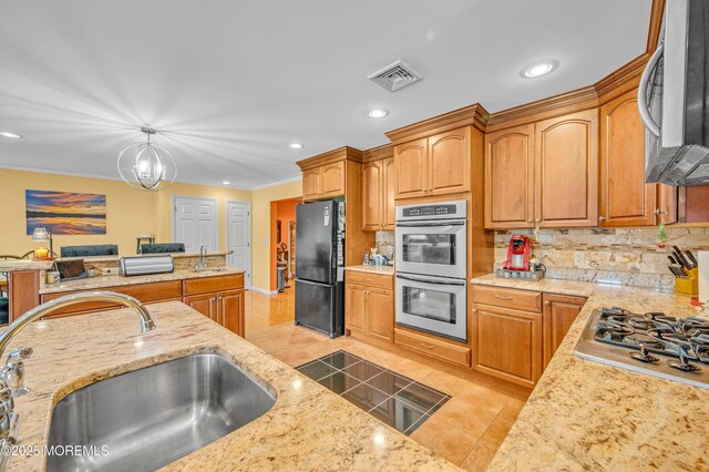 255 Cherokee Trl, Forked River, NJ 08731 - kitchen with appliances with stainless steel finishes, a sink, tasteful backsplash, crown molding, and light tile patterned floors