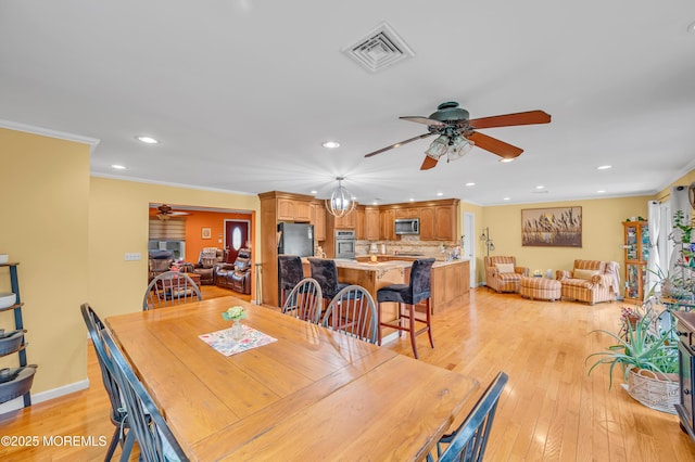 255 Cherokee Trl, Forked River, NJ 08731 - dining area featuring a ceiling fan, recessed lighting, ornamental molding, and light wood-style flooring