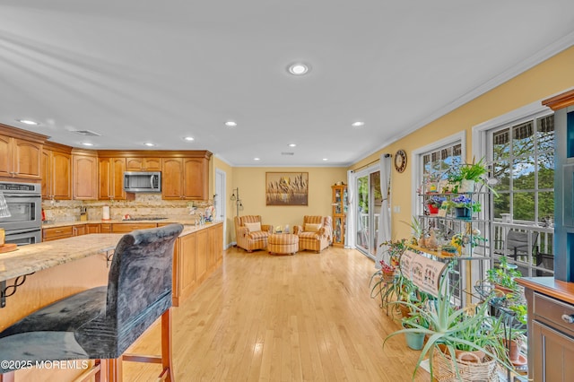 255 Cherokee Trl, Forked River, NJ 08731 - kitchen featuring stainless steel appliances, tasteful backsplash, ornamental molding, light wood finished floors, and recessed lighting