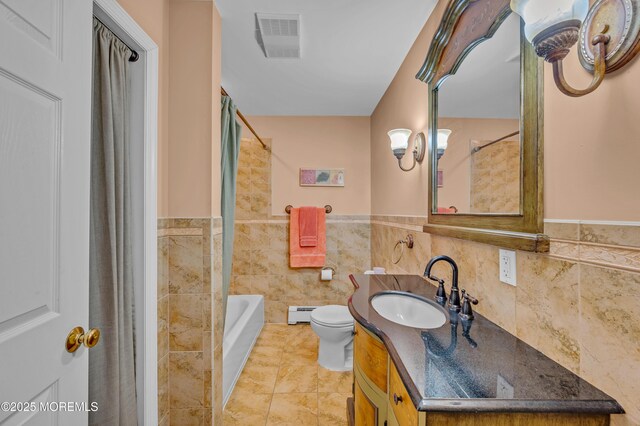 255 Cherokee Trl, Forked River, NJ 08731 - full bathroom with toilet, vanity, tile walls, wainscoting, and tile patterned floors