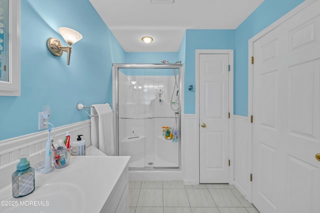 255 Cherokee Trl, Forked River, NJ 08731 - bathroom with a wainscoted wall, a stall shower, vanity, and tile patterned flooring