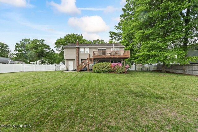 rear view of property with stairway, a deck, and a chimney