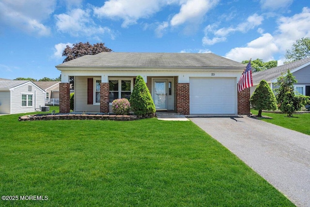 25 Elmswell Ave, Manchester, NJ 08759 - view of front of property with brick siding, asphalt driveway, a garage, and a front yard