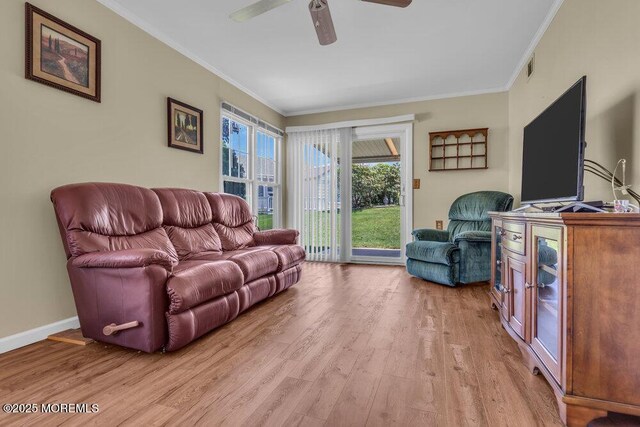 25 Elmswell Ave, Manchester, NJ 08759 - living area featuring light wood-style floors, ceiling fan, ornamental molding, and baseboards