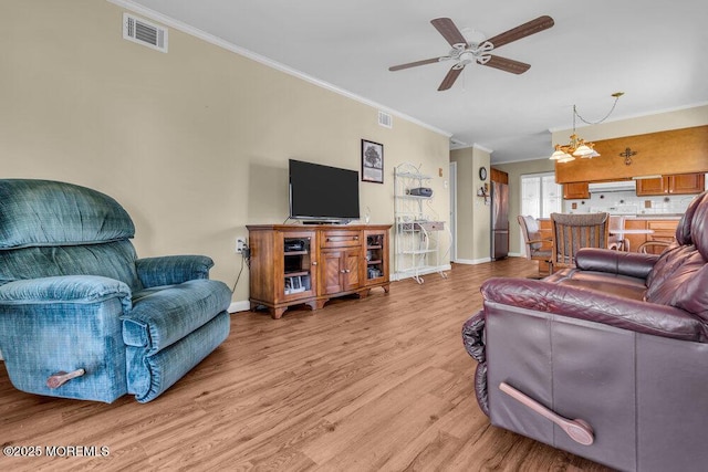 25 Elmswell Ave, Manchester, NJ 08759 - living room with ornamental molding, baseboards, light wood-style floors, and a ceiling fan