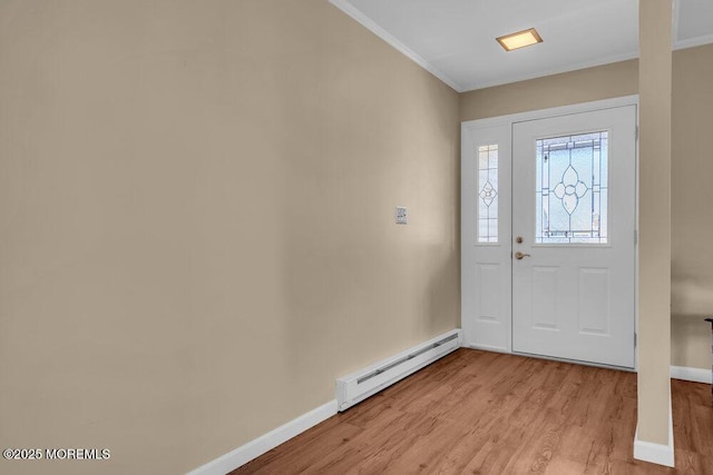 25 Elmswell Ave, Manchester, NJ 08759 - foyer with a baseboard radiator, ornamental molding, baseboards, and light wood-type flooring