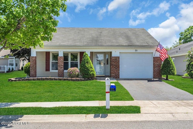25 Elmswell Ave, Manchester, NJ 08759 - view of front of property featuring brick siding, a garage, driveway, a front yard, and a shingled roof