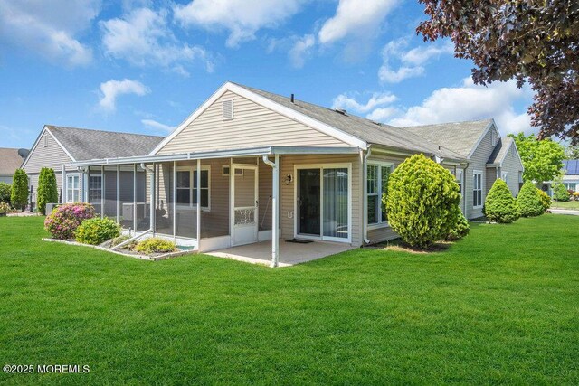 25 Elmswell Ave, Manchester, NJ 08759 - rear view of house with a yard, a patio, and a sunroom