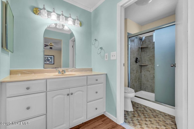25 Elmswell Ave, Manchester, NJ 08759 - bathroom featuring crown molding, toilet, a stall shower, vanity, and ceiling fan