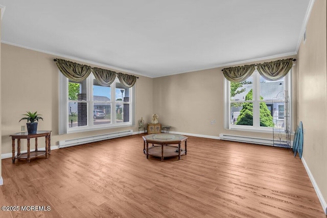 25 Elmswell Ave, Manchester, NJ 08759 - living area with baseboard heating, crown molding, wood finished floors, and healthy amount of natural light