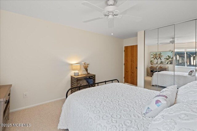 77 E Water St Unit 18, Toms River, NJ 08753 - bedroom with carpet, a closet, baseboards, and a ceiling fan