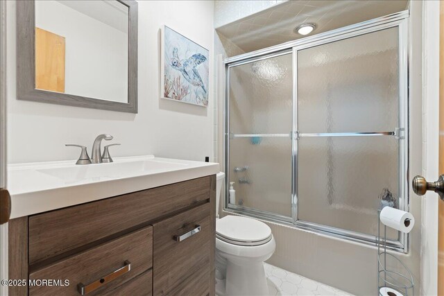 77 E Water St Unit 18, Toms River, NJ 08753 - bathroom with toilet, vanity, and bath / shower combo with glass door