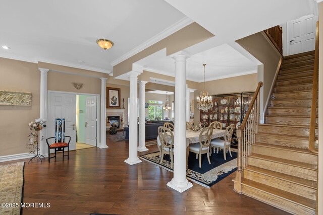 5 Chadwick Ct, Waretown, NJ 08758 - entrance foyer featuring stairs, crown molding, decorative columns, wood finished floors, and a chandelier