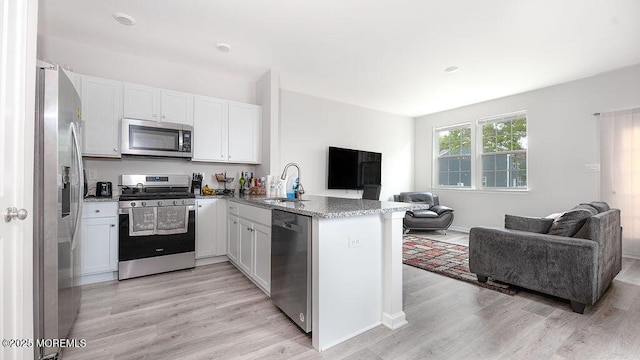 1214 Peterson Way, Abescon, NJ 08201 - kitchen featuring appliances with stainless steel finishes, open floor plan, a sink, and a peninsula