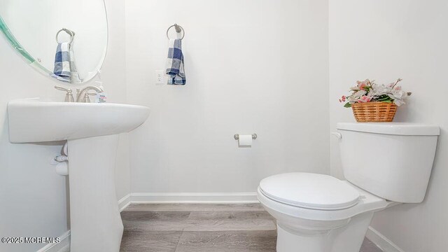 1214 Peterson Way, Abescon, NJ 08201 - half bathroom featuring baseboards, toilet, and wood finished floors