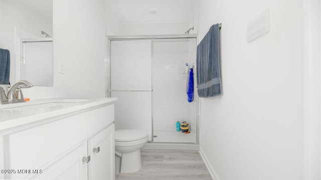 1214 Peterson Way, Abescon, NJ 08201 - full bathroom featuring toilet, vanity, wood finished floors, and a stall shower