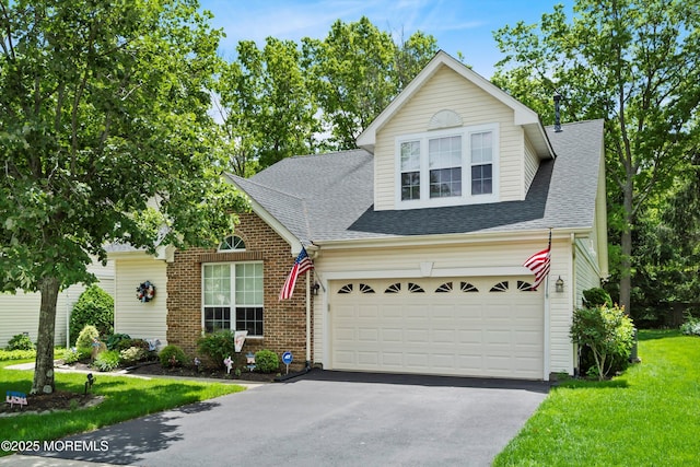 102 Sylvan Lake Blvd, Bayville, NJ 08721 - traditional home with driveway, a shingled roof, a front lawn, and brick siding