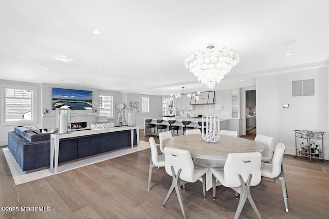 948 Lagoon Ln S, Mantoloking, NJ 08738 - dining room featuring a chandelier, wood finished floors, healthy amount of natural light, and recessed lighting