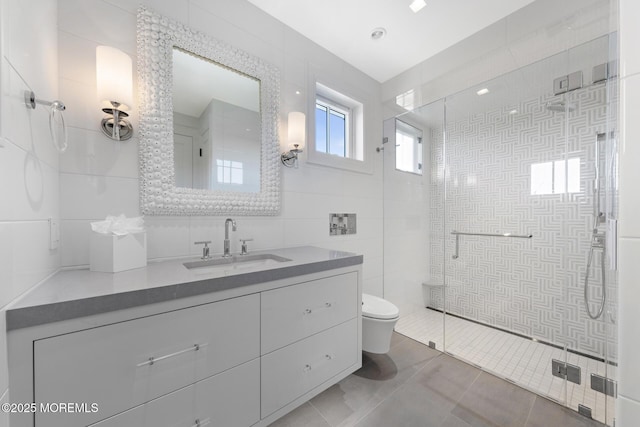 948 Lagoon Ln S, Mantoloking, NJ 08738 - full bathroom featuring tile walls, toilet, a shower stall, vanity, and tile patterned flooring