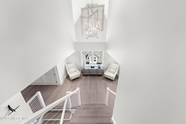 948 Lagoon Ln S, Mantoloking, NJ 08738 - living area featuring a chandelier, wood finished floors, baseboards, and a high ceiling