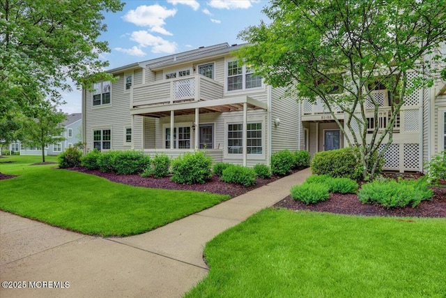 82 Briarwood Ct, Howell, NJ 07731 - rear view of house featuring a lawn