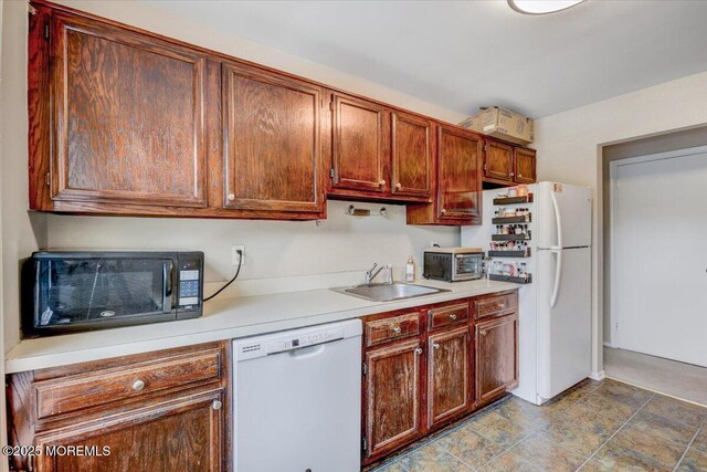 82 Briarwood Ct, Howell, NJ 07731 - kitchen with white appliances, a sink, and light countertops