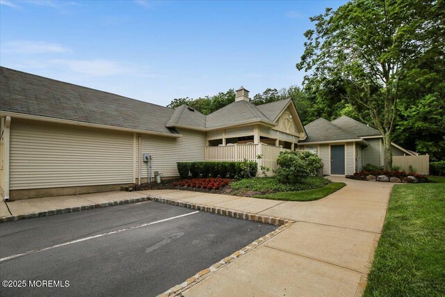 82 Briarwood Ct, Howell, NJ 07731 - view of front facade with a chimney