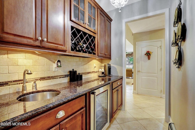 50 Hedgerow Ln, Manalapan, NJ 07726 - kitchen with beverage cooler, a sink, dark stone counters, backsplash, and light tile patterned floors