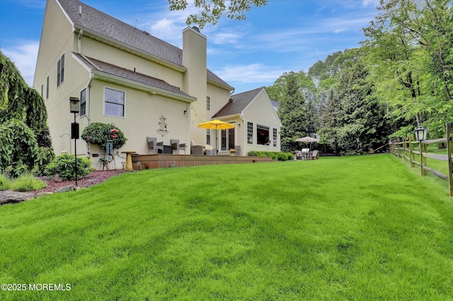 50 Hedgerow Ln, Manalapan, NJ 07726 - back of property featuring a chimney and stucco siding