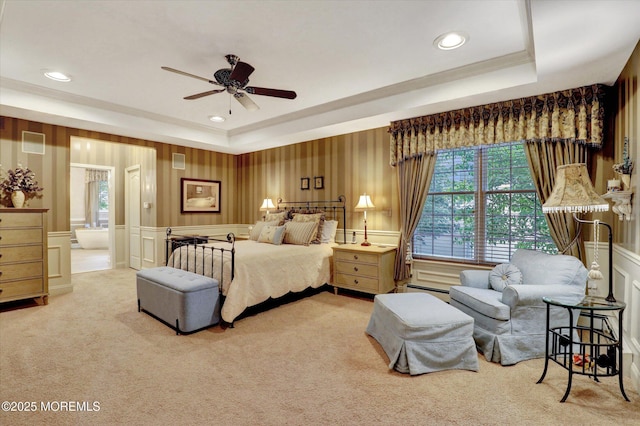 50 Hedgerow Ln, Manalapan, NJ 07726 - bedroom with light carpet, a tray ceiling, a decorative wall, recessed lighting, and ensuite bath