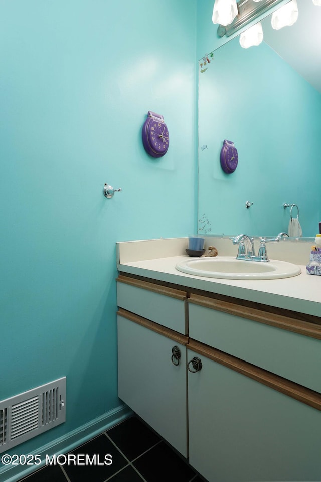 bathroom featuring tile patterned floors and vanity