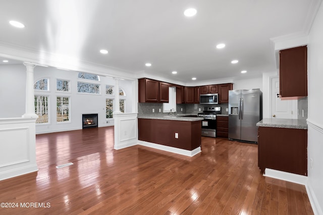 6 Afton Rd, Jackson, NJ 08527 - kitchen with appliances with stainless steel finishes, crown molding, a peninsula, dark wood-style floors, and open floor plan