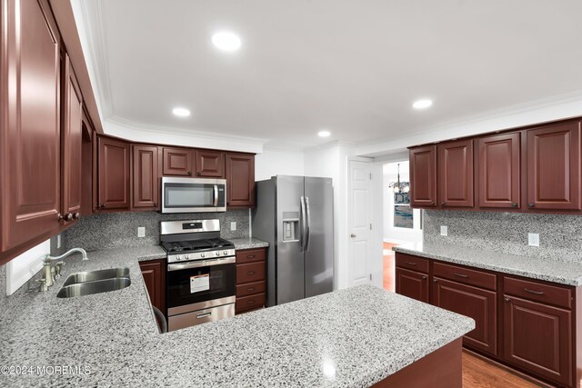 6 Afton Rd, Jackson, NJ 08527 - kitchen with appliances with stainless steel finishes, a sink, tasteful backsplash, crown molding, and light stone counters