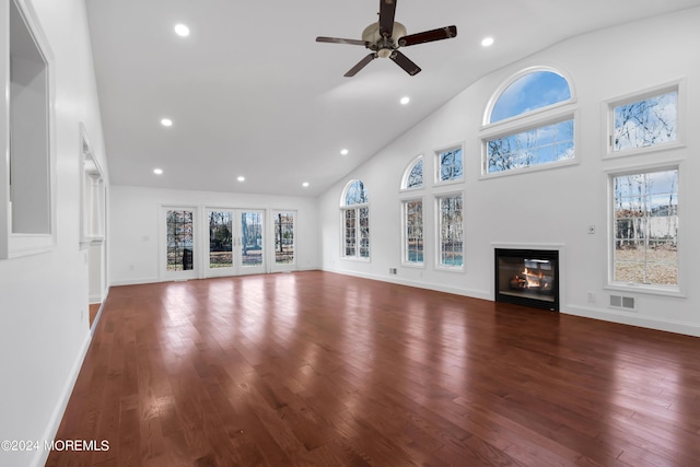 6 Afton Rd, Jackson, NJ 08527 - unfurnished living room featuring hardwood / wood-style flooring, a glass covered fireplace, healthy amount of natural light, high vaulted ceiling, and recessed lighting