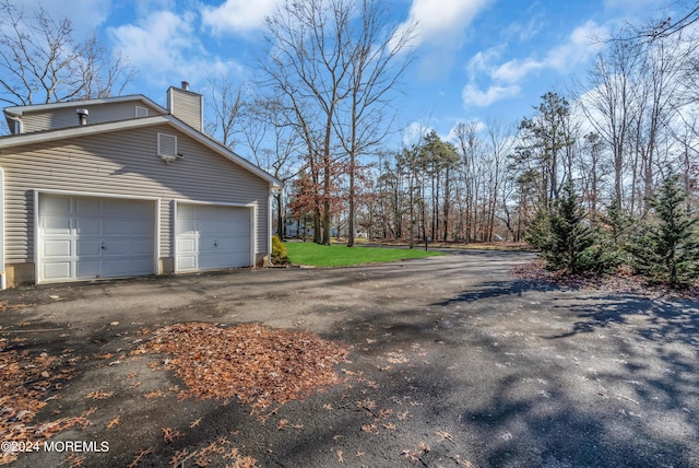 6 Afton Rd, Jackson, NJ 08527 - view of side of home with a chimney and a garage