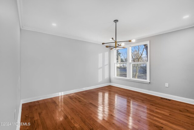 6 Afton Rd, Jackson, NJ 08527 - unfurnished dining area featuring crown molding, a chandelier, baseboards, and wood finished floors