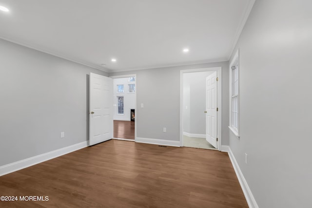 6 Afton Rd, Jackson, NJ 08527 - unfurnished bedroom with crown molding, recessed lighting, baseboards, dark wood finished floors, and a warm lit fireplace