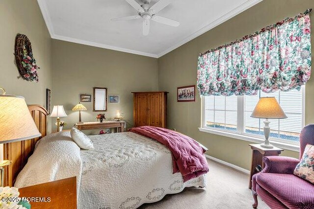 bedroom featuring carpet flooring, baseboards, crown molding, and a ceiling fan