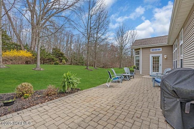 view of patio with a grill
