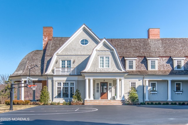 0 Wilson Cir, Rumson, NJ 07760 - view of front facade featuring a chimney, a balcony, and a gambrel roof