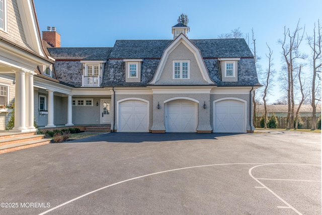 0 Wilson Cir, Rumson, NJ 07760 - view of front of property featuring asphalt driveway, an attached garage, a porch, and roof with shingles