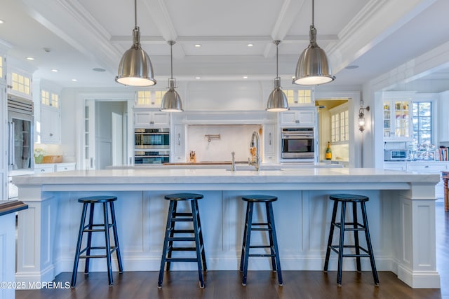 0 Wilson Cir, Rumson, NJ 07760 - kitchen featuring a sink, stainless steel double oven, white cabinets, dark wood-style flooring, and crown molding